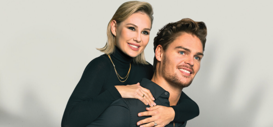 couple with short haircuts dressed up in black