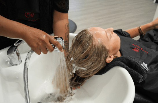 Guest getting hair shampoo'd
